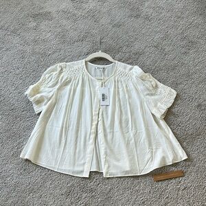 Adeline smocked top by Reformation in size S.